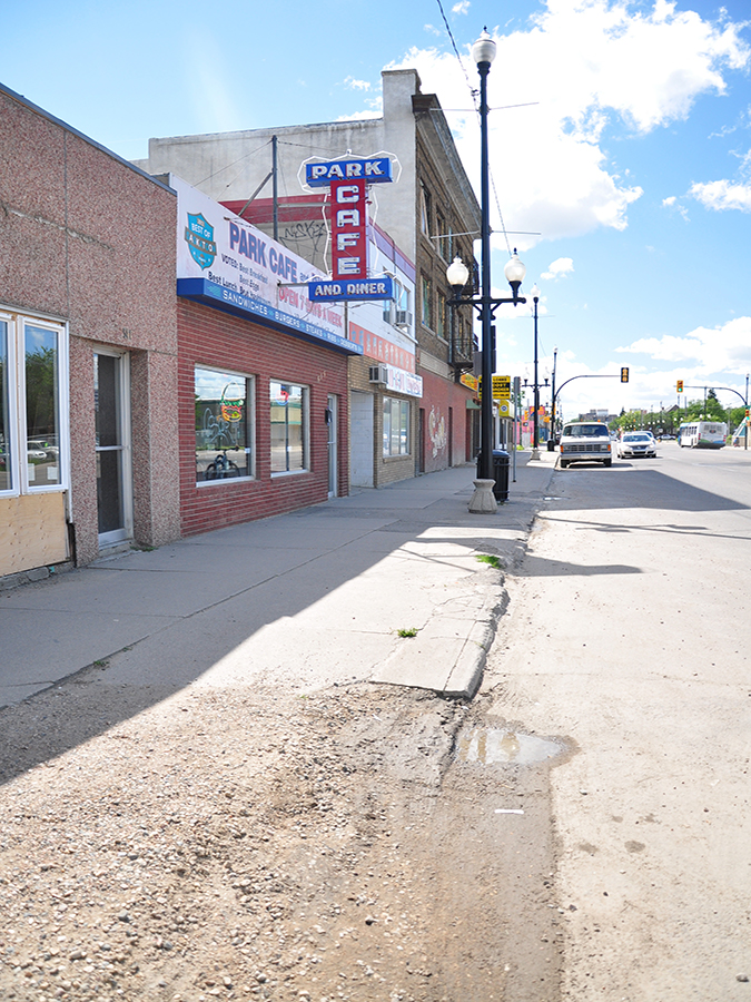 20th Street west street before construction. Image highlights a deteriorated sidewalk and poor state of the public realm.